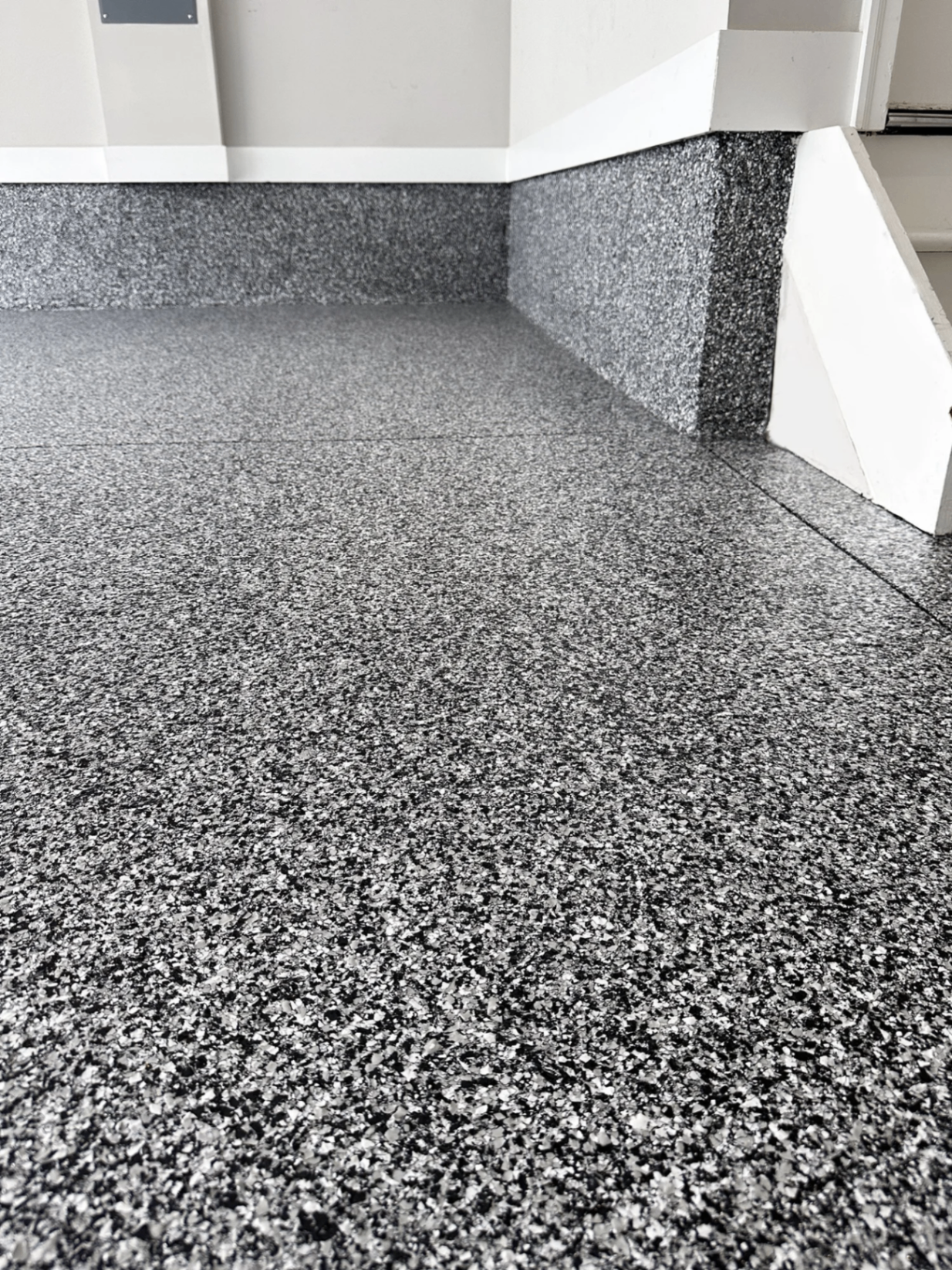 Close-up of a decorative flake epoxy floor finish